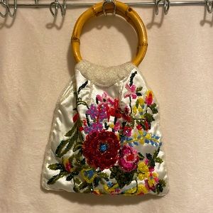 Silky beaded bag with bamboo handles. All beads in tact